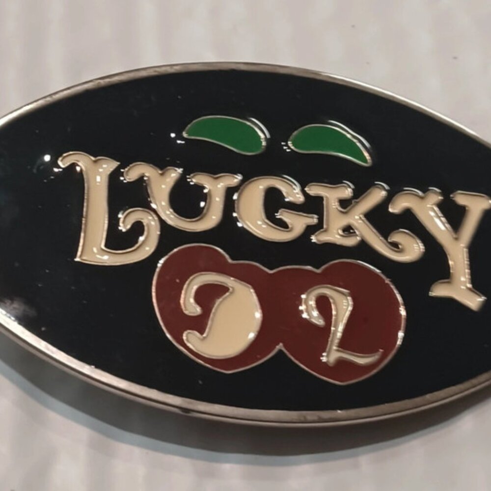 A BEAUTIFUL BRAND NEW LUCKY CHERRY BELT BUCKLE MEASURES ABOUT 3.5 BY 2.5 INCHES